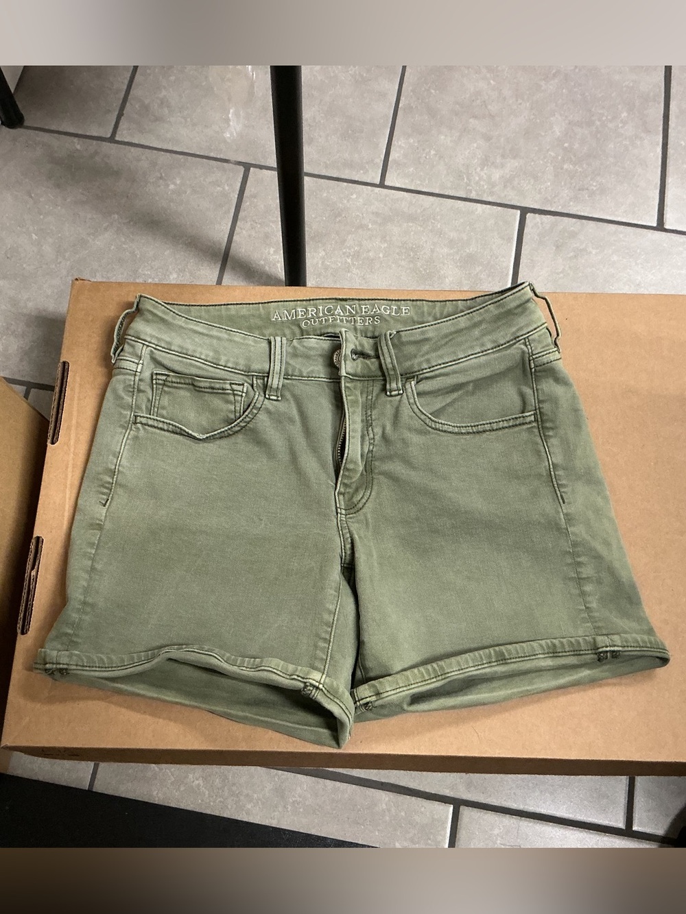 AE green jean shorts size 6